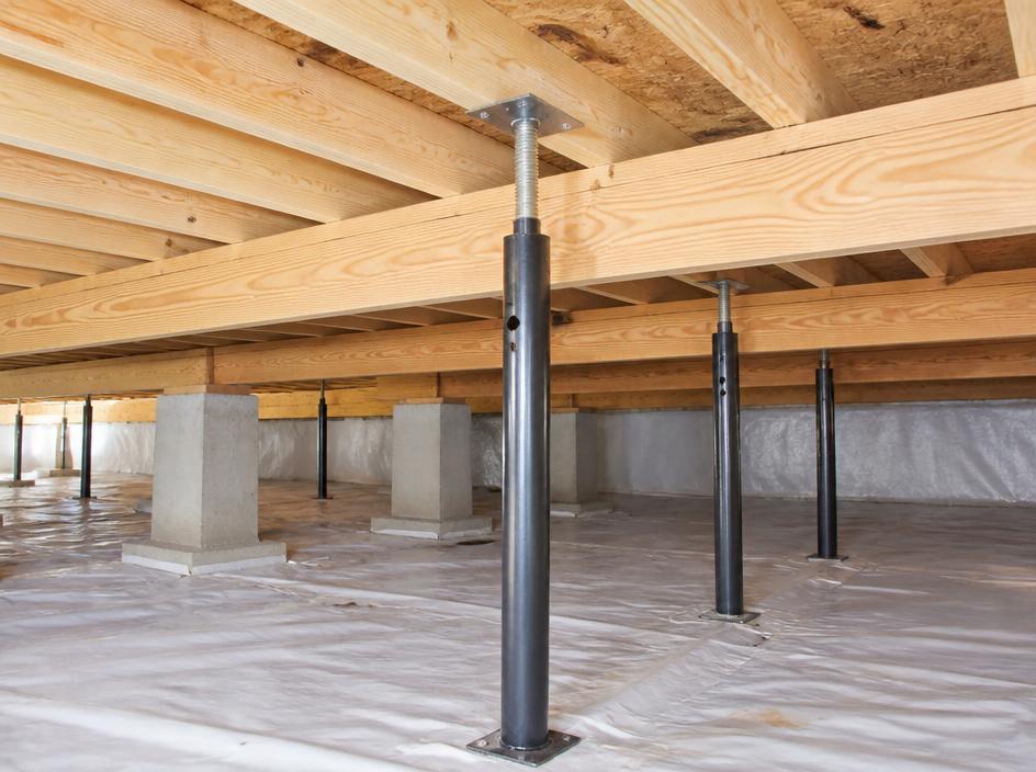Heavy-duty steel jack posts supporting wooden subfloor beams